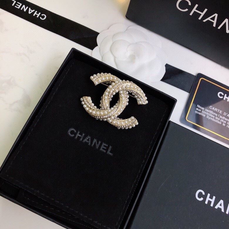 Ch**el brooches